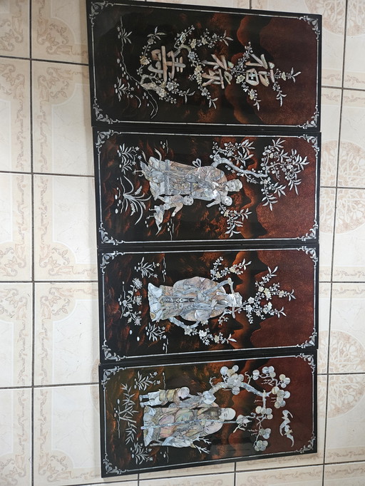 Set of four handcrafted panels in brown lacquer and mother-of-pearl, origin Vietnam, circa 1970