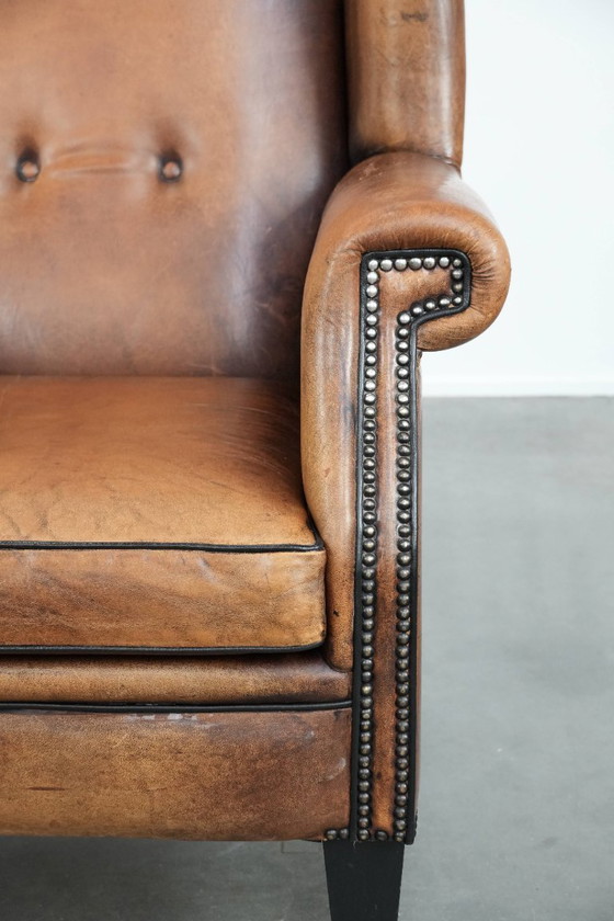Image 1 of Sheepskin wing chair with a characterful appearance