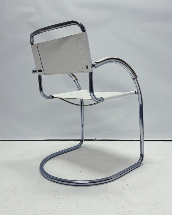Image 1 of Vintage tubular frame chairs with white skai