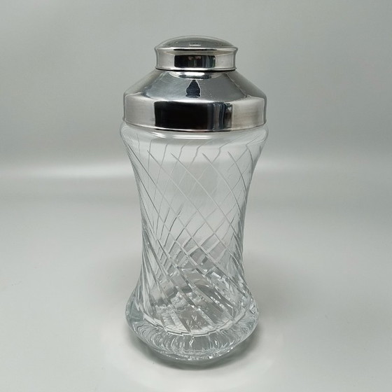Image 1 of https://madinteriorart.com/collections/tableware/products/1950s-gorgeous-cut-crystal-cocktail-shaker-made-in-italy-copia