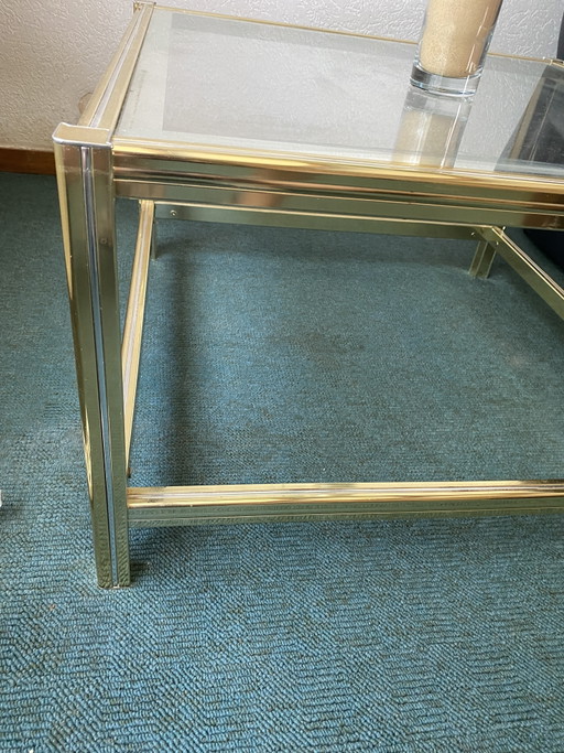 Couchtisch aus Glas mit goldenen Details