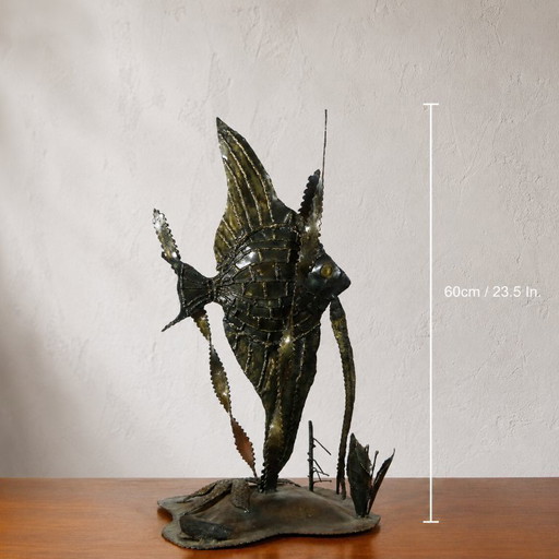 Large brutalist sculpture of an angelfish made of welded metal, circa 1970