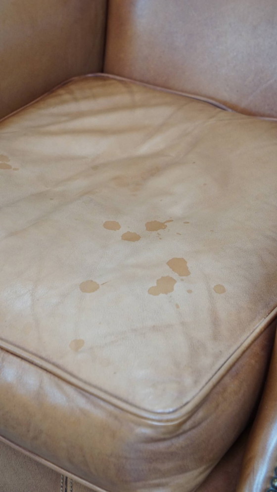 Image 1 of 2x Rundleren oorfauteuil afgewerkt met siernagels