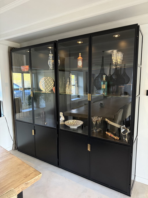Handmade steel cabinets with LED lighting and brass handles