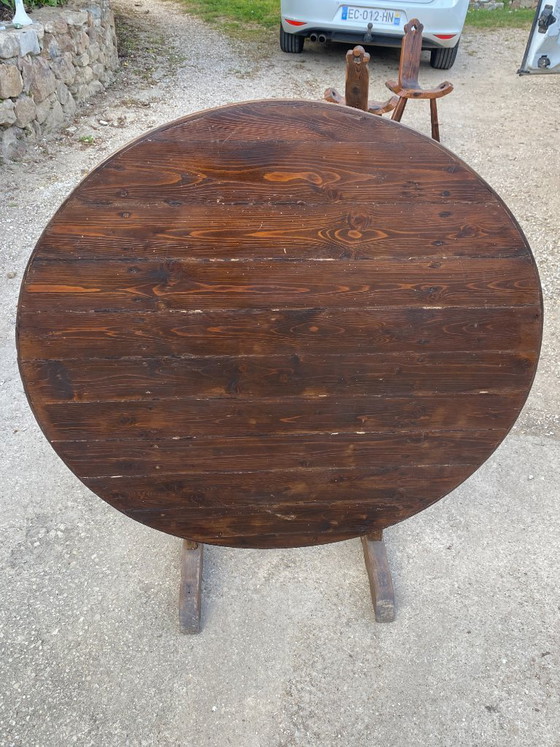 Image 1 of antique folding round winemaker's target table with tilting top