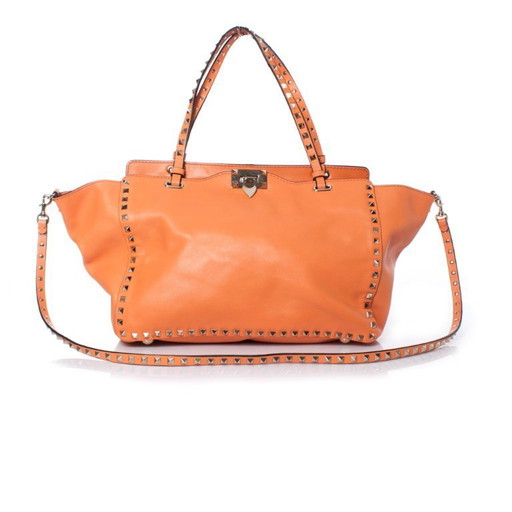 Valentino Garavani, borsa tote Rockstud Trapeze arancione.