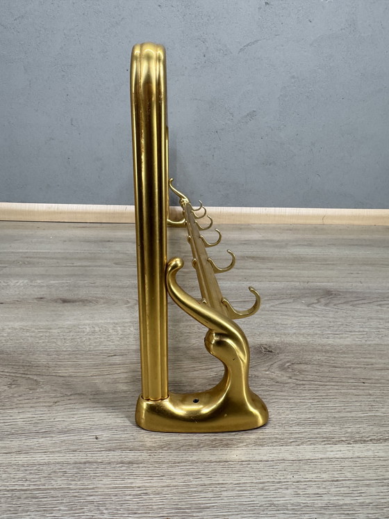 Image 1 of Vintage metalen wandkapstok met touw