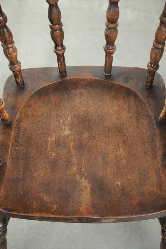 Image 1 of 2x antique English wooden pub/captain chairs from the late 19th century with character and a beautiful color scheme
