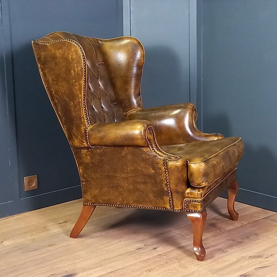 Image 1 of Cognac kleurige Vintage chesterfield fauteuil. 1 van 2