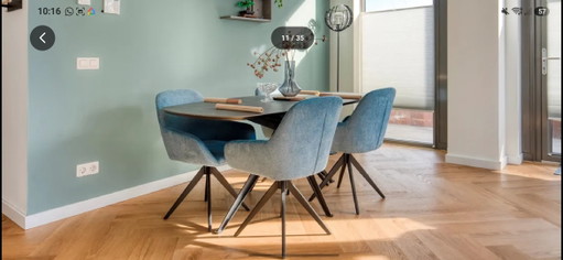 Modern Danish oval dining table with 4 swivel chairs