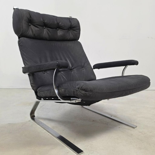 Swing chair 60's chrome met grijs leer