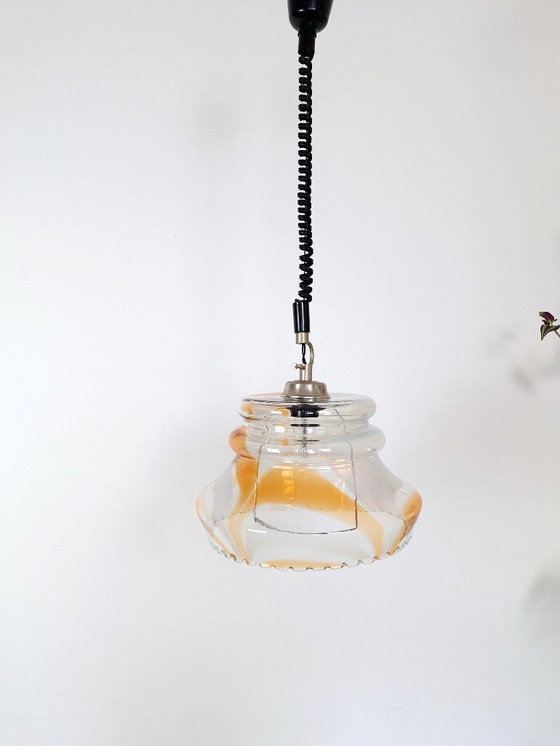Image 1 of Vintage 1970s Yugoslavian Pendant Light / Mid-Century Glass Ceiling Lamp / Retro Amber Swirl Hanging Light