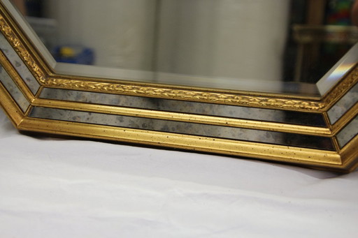 1 large wall mirror with gold embossed decoration