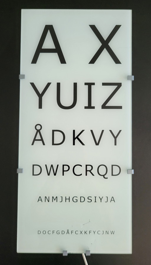 Lampada da parete vintage IKEA, modello Gyllen Eye Exam, oggetto da collezione.