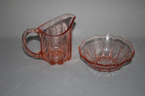 Image 1 of Art Deco Rosalinglas pressed glass pink milk sugar set with floral motif on the bottom