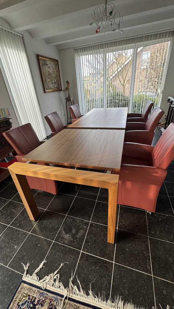 Image 1 of Dining table with 8 leather chairs in my