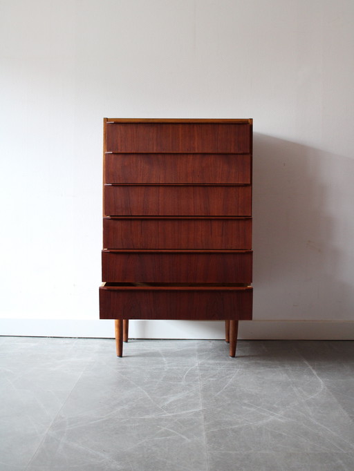 Vintage Danish narrow and tall chest of drawers in teak