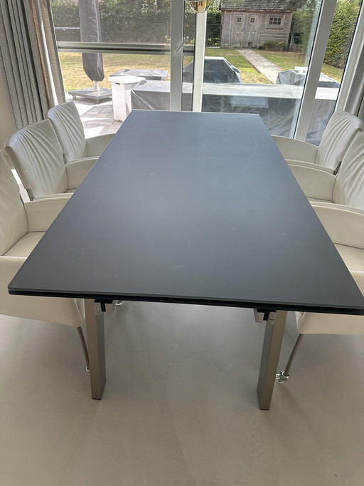 Joli dining table with fumed gray glass