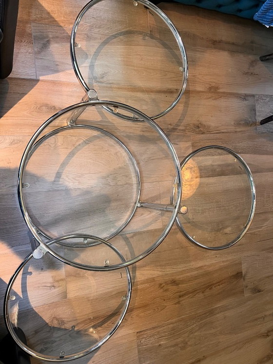 Unique vintage Italian coffee table with chrome frame and four round glass tops. Three outer tops can be (photo 6 of 10)