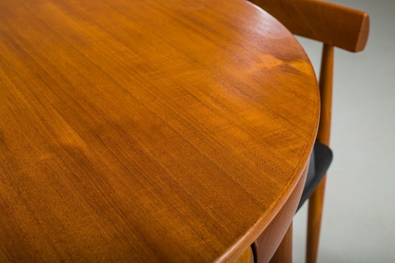 Image 1 of Mesa de comedor extensible y sillas danesas de teca de Hans Olsen para Frem Røjle, años 60, juego de 7