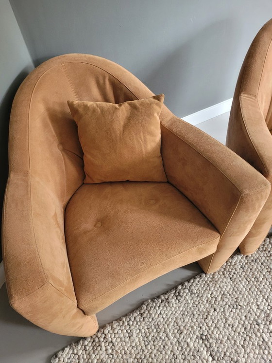 Image 1 of Two Leolux armchairs (Carabas model), one footstool, and three cushions. Upholstery: Alcantara.