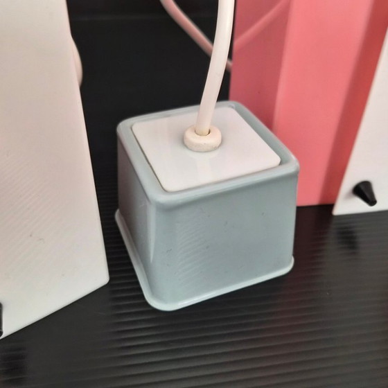 Image 1 of SET VAN 3 VINTAGE ROZE & WITTE PLEXIGLAS HANGERS UIT DE JAREN 50, ROCKABILLY-STIJL