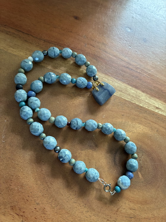 Image 1 of New necklace with blue vintage beads and a small agate bag as a pendant