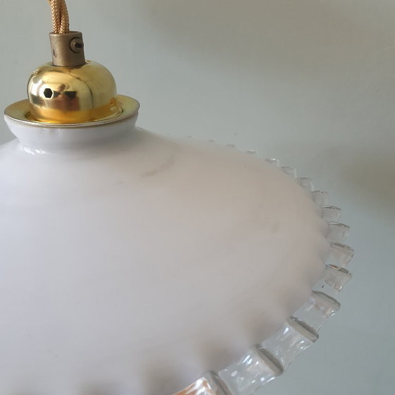 Image 1 of 2 vintage hanglampen van wit opaline glas met een transparante sierrand.