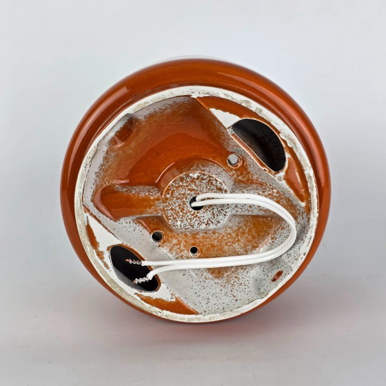 Image 1 of Vintage German ceramic lamp with a glass globe shade. Can be used as a wall lamp, table lamp, or sconce. Orange. 70s / retro