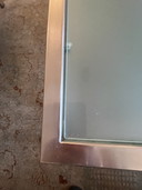 Glazen salontafel in roestvrijstalen frame