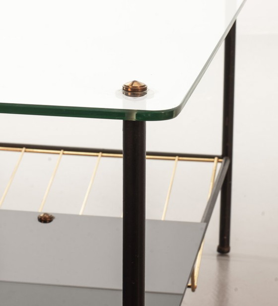 Image 1 of Mid-Century Pierre Guariche Glass Coffee / Side Table for Airborne in Black Steel with Brass Magazine Holder. France, 1950s. 