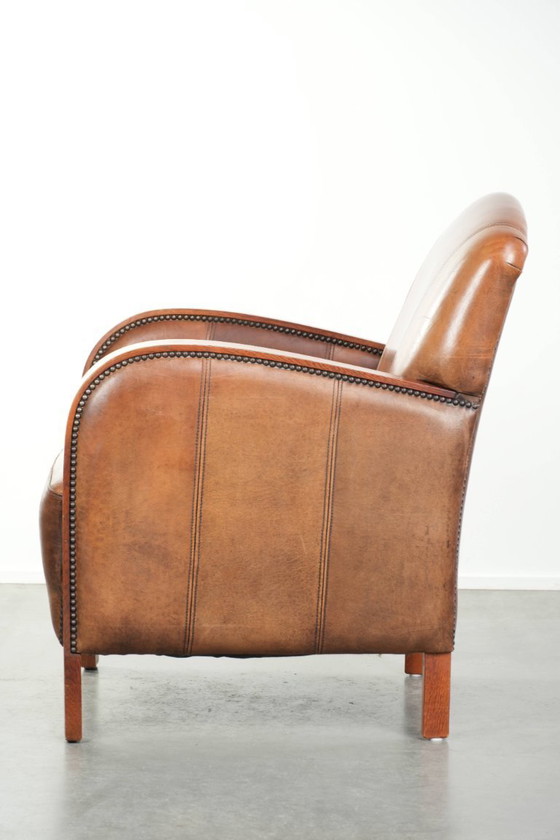 Image 1 of Beautiful sheepskin armchair in Art Deco style with wooden armrests