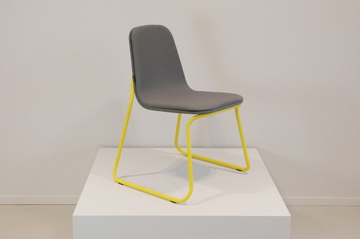 Bogaerts stackable cantilever chair in yellow frame with gray upholstery