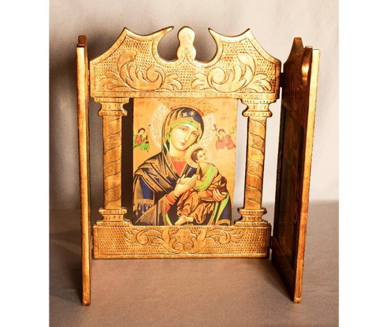 Image 1 of Religious triptych of carved wood and gold leaf. Painting with Virgin and Child. Folding picture with illustration.