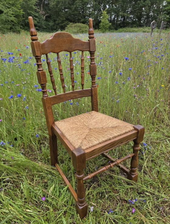 Image 1 of Set van 4 massief eiken stoelen met rieten zitting