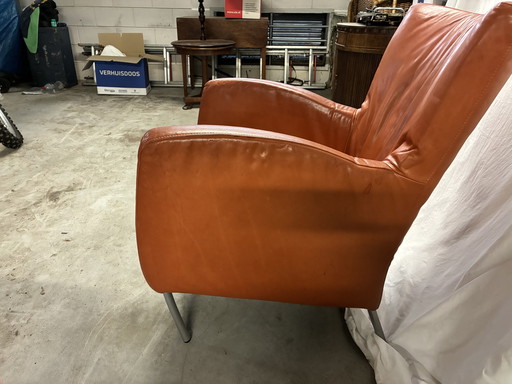 Warm oranje leren fauteuil 