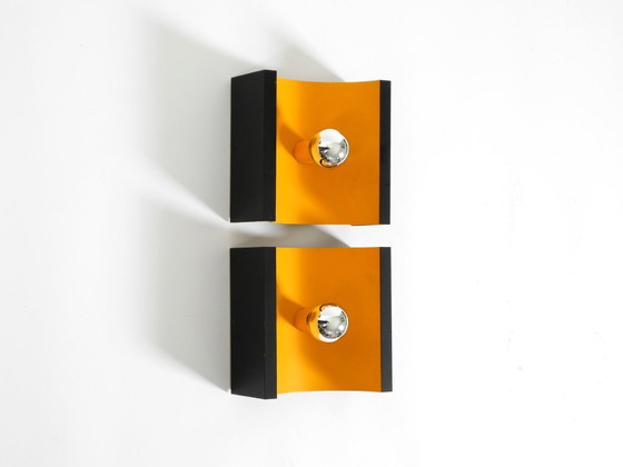 Image 1 of A rare pair of original 1960s Space Age metal wall lamps by Klaus Hempel for Kaiser Leuchten in yellow and black