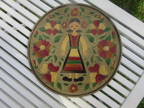Image 1 of Mid century Enamelled Metal Folk Art Wall Plate - young girl and floral design - diam. 20 cm