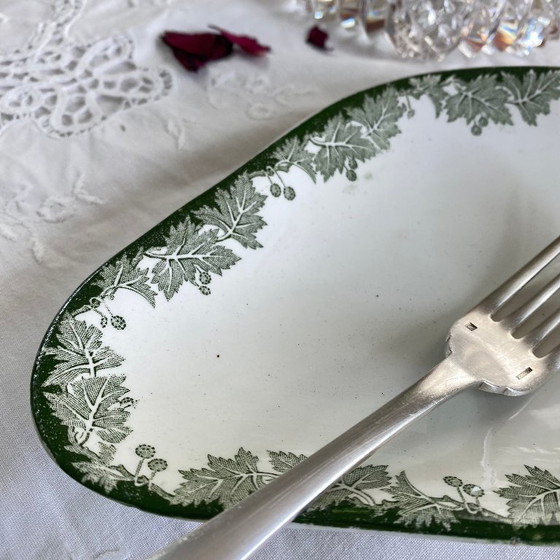 Image 1 of Piccolo piatto da portata in terracotta di Saint Amand et Hamage, motivo a platano verde