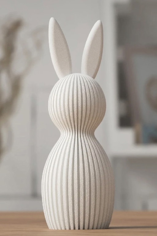 Coniglietto pasquale moderno con 3 piccole uova colorate. Offerta di 7 € se interessati.