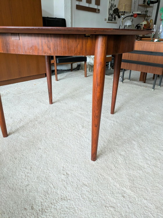 Vintage rosewood round extendable dining table (photo 10 of 11)