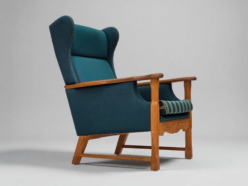 1970er Jahre, dänischer Hochlehnersessel, türkisgrüne Möbelwolle, massives Eichenholz.