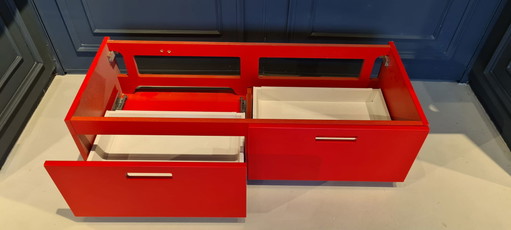 Marike, nice red cupboard with two drawers,