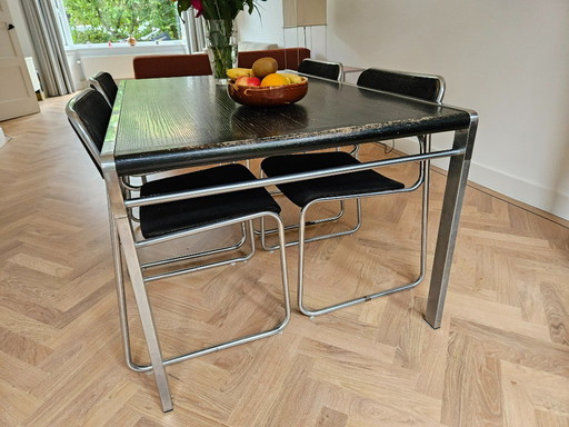 Vintage dining table with 4x tube chairs | Bataille & Ibens