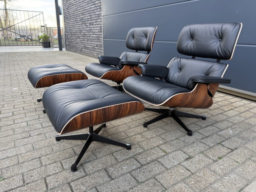 2 poltrone lounge Vitra Eames XL originali con poggiapiedi, in pregiata pelle nera e palissandro Santos, NUOVE!!