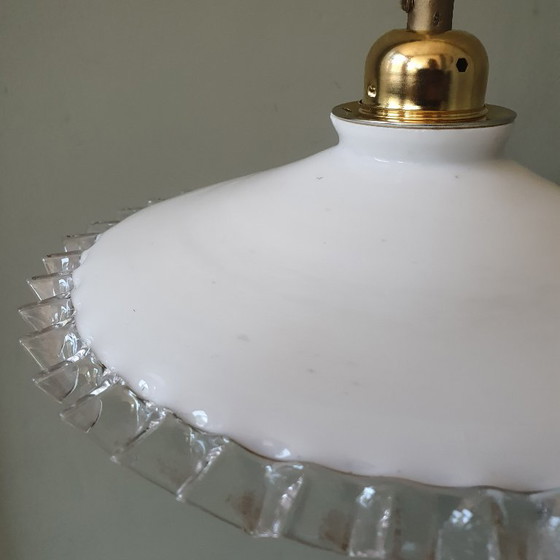 Image 1 of 2 vintage hanglampen van wit opaline glas met een transparante sierrand.