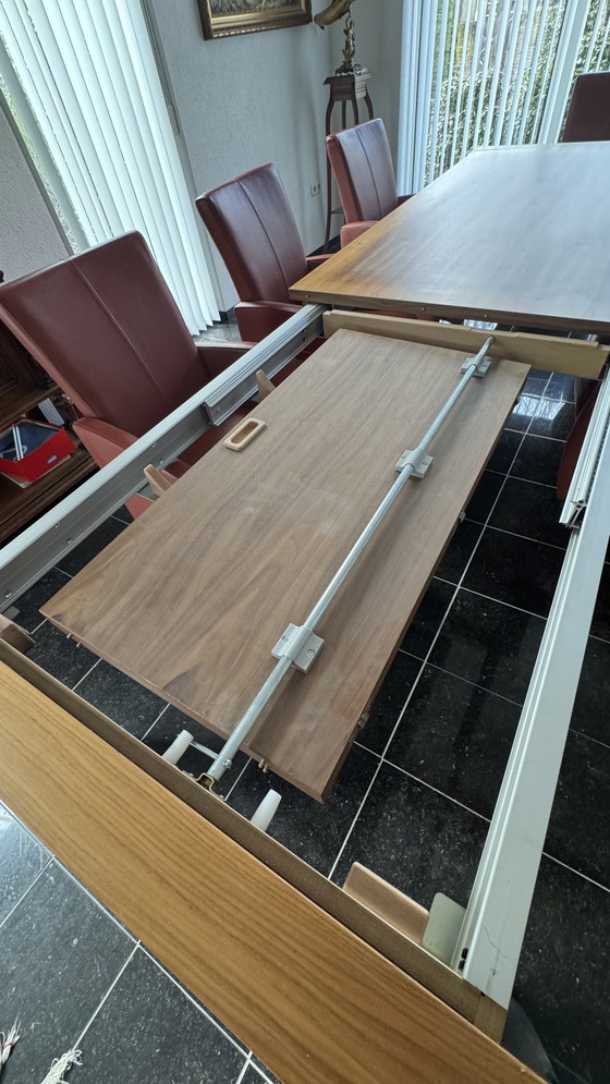 Image 1 of Dining table with 8 leather chairs in my