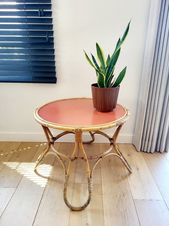 Image 1 of Rattan Couchtisch Modell Diabolo, Design KOK mit orangefarbener Platte