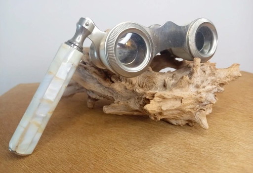 Vintage theatre glasses (opera glasses), made of metal and finished with mother-of-pearl (nacre) shell inlay.
