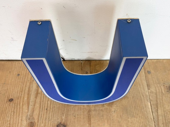 Image 1 of Industrial dark blue enamel factory pendant light made in United Kingdom during the 1950s. White enamel inside the shade. Brass 